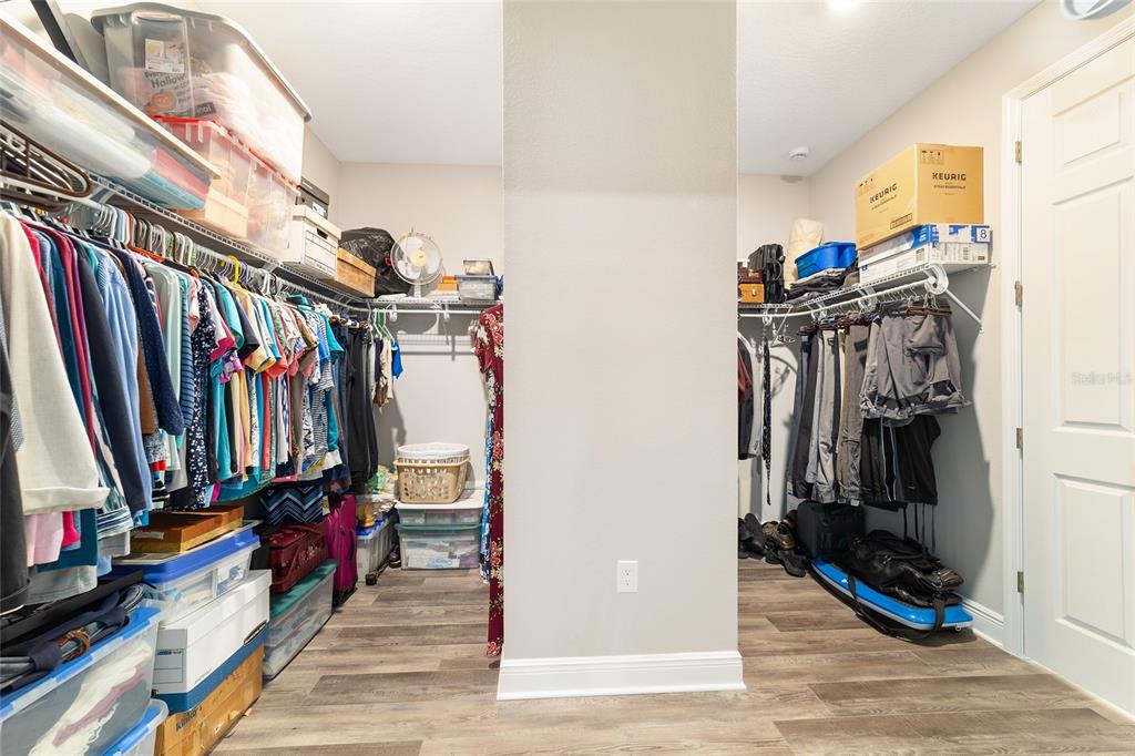 8457 Southwest 97th Circle Ocala, FL 34481 - Photo 42 of 62 a view of walk in closet with clothes