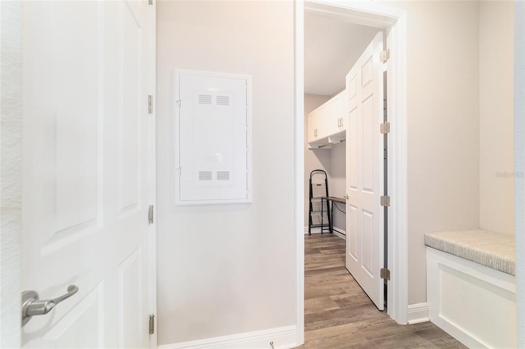 8457 Southwest 97th Circle Ocala, FL 34481 - Photo 45 of 62 a view of a hallway with wooden floor and staircase