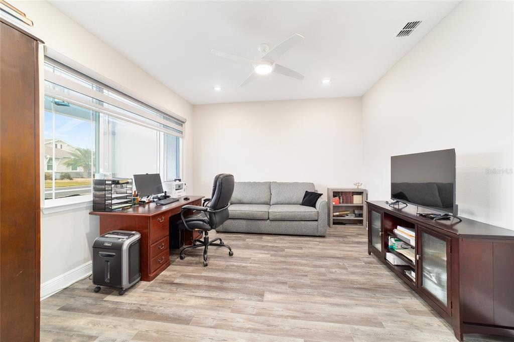 8457 Southwest 97th Circle Ocala, FL 34481 - Photo 46 of 62 a view of a livingroom with workspace and a window