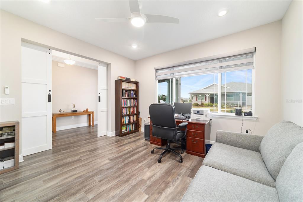 8457 Southwest 97th Circle Ocala, FL 34481 - Photo 47 of 62 a view of a livingroom with workspace and a window