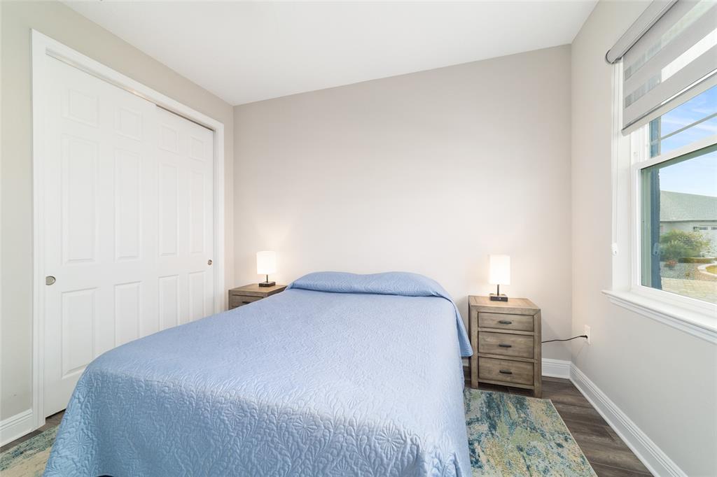 8457 Southwest 97th Circle Ocala, FL 34481 - Photo 51 of 62 a bedroom with a bed chair and a window