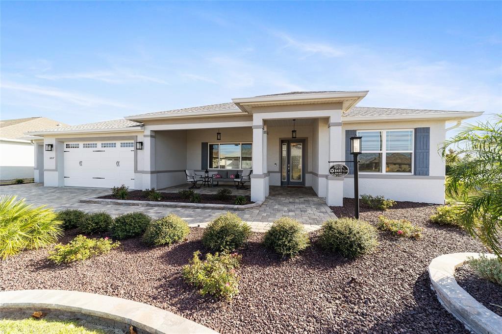 8457 Southwest 97th Circle Ocala, FL 34481 - Photo 6 of 62 a front view of a house with garden
