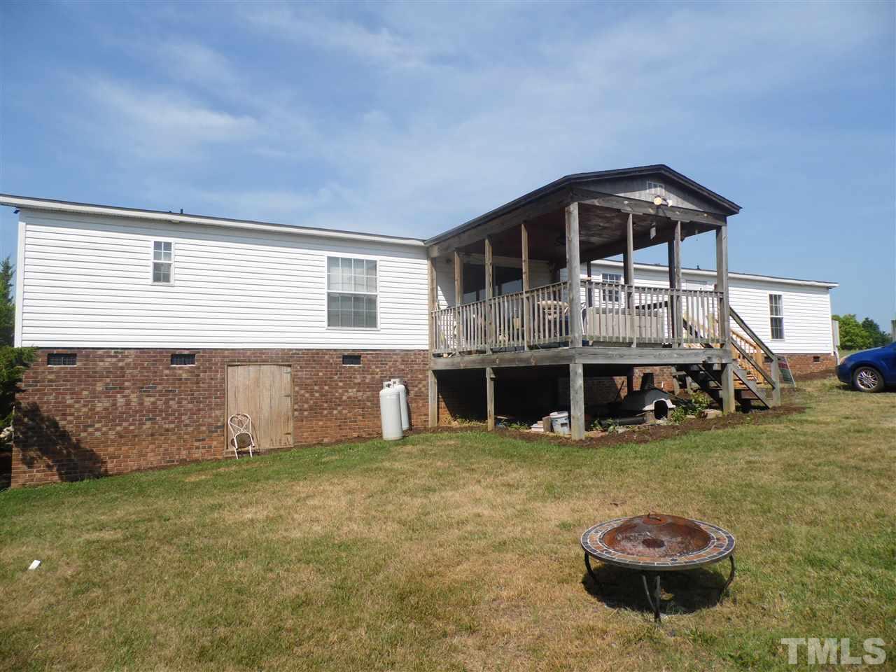 10582 Cone Road Middlesex, NC 27557 - Photo 2 of 25 a front view of a house with garden