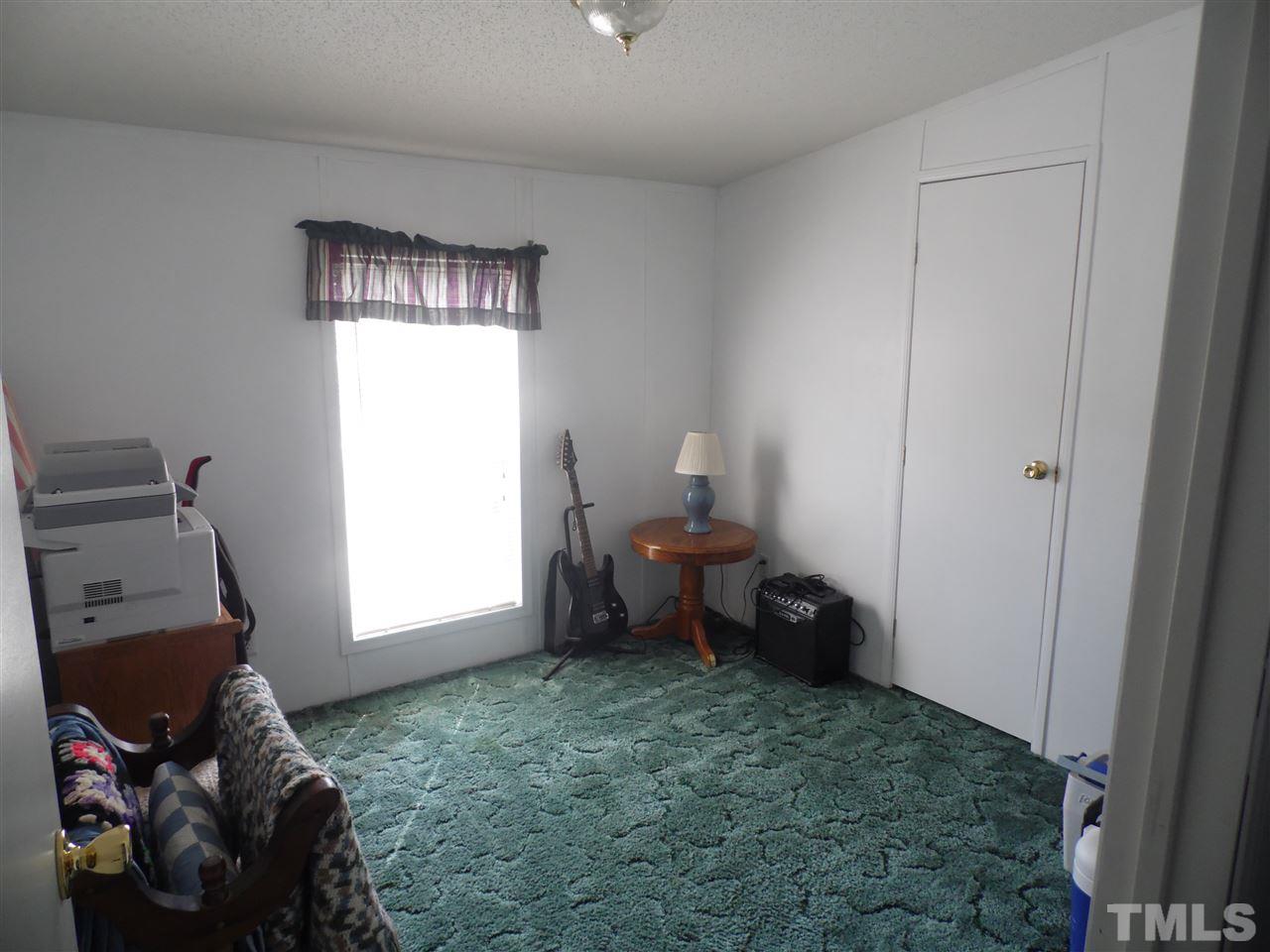 10582 Cone Road Middlesex, NC 27557 - Photo 12 of 25 a living room with furniture and a window