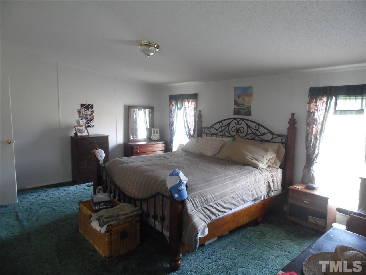10582 Cone Road Middlesex, NC 27557 - Photo 15 of 25 a bedroom with a bed and a window