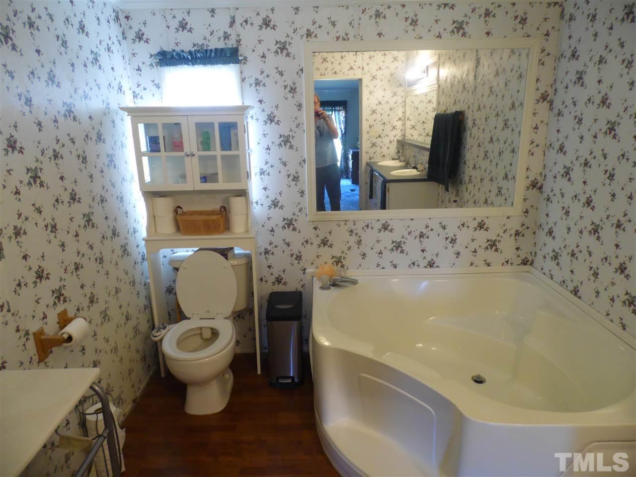 10582 Cone Road Middlesex, NC 27557 - Photo 19 of 25 a bathroom with a sink and a toilet