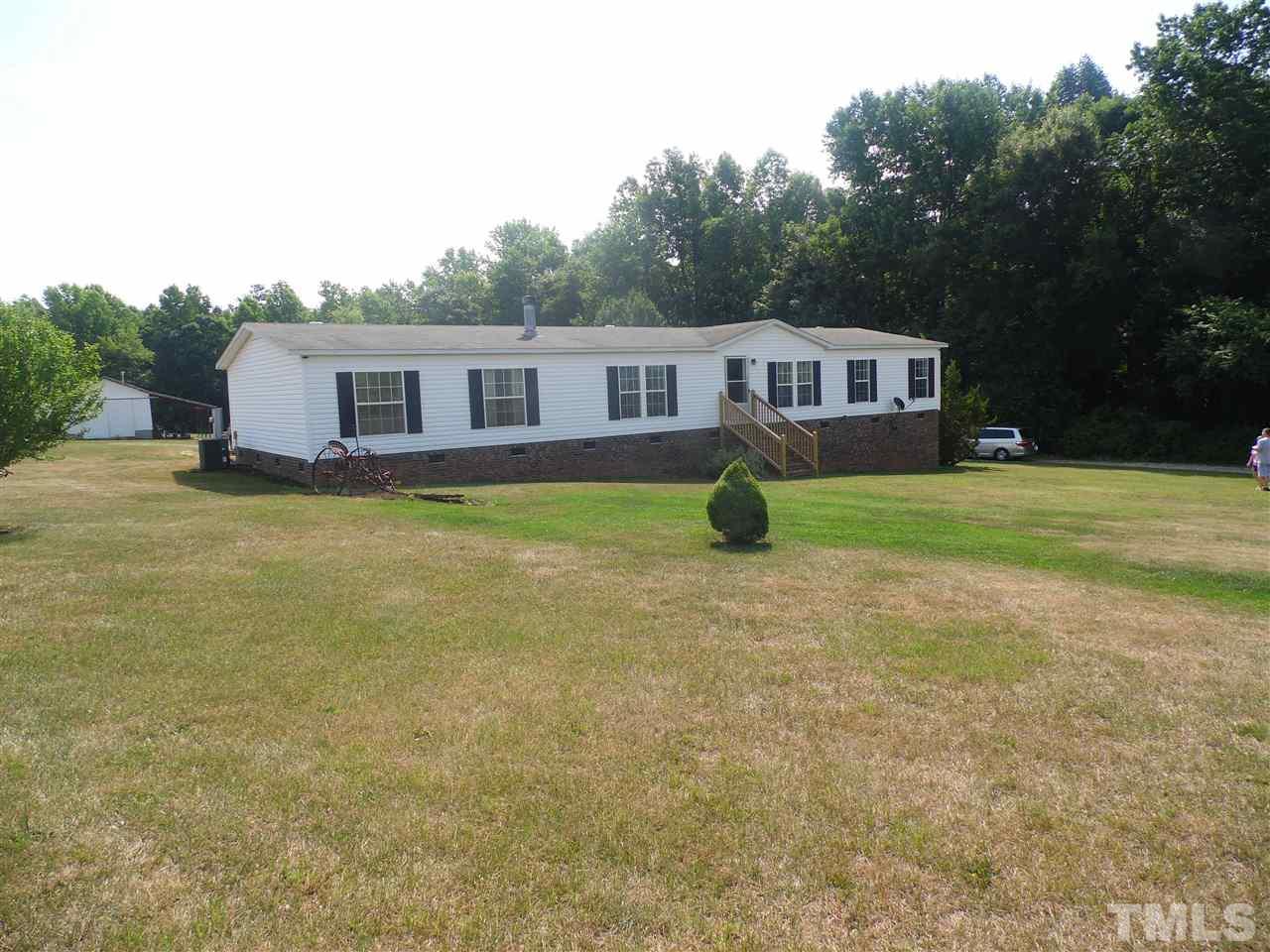 10582 Cone Road Middlesex, NC 27557 - Photo 21 of 25 a front view of a house with yard and green space