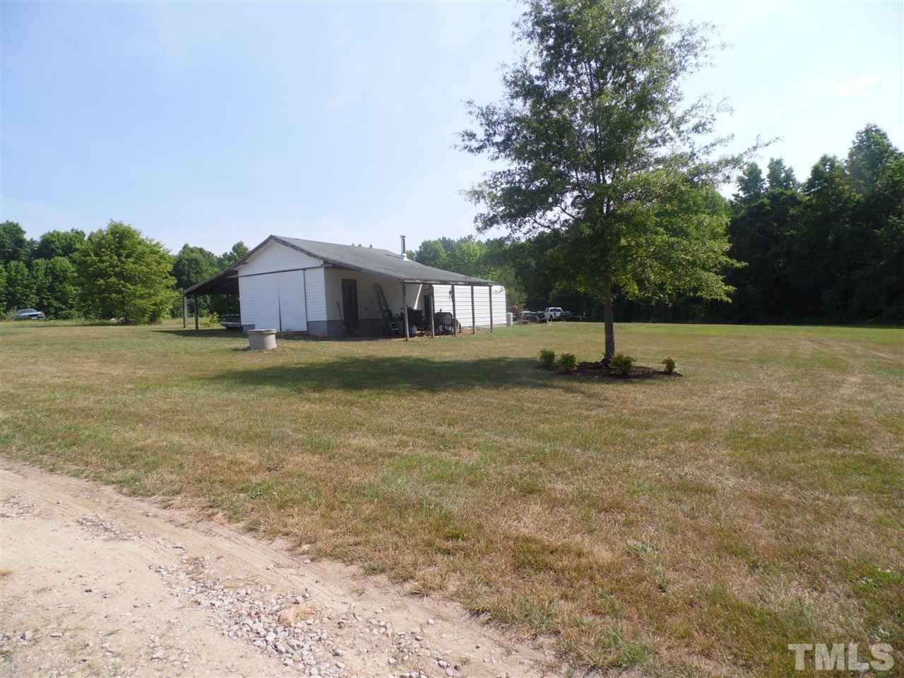 10582 Cone Road Middlesex, NC 27557 - Photo 24 of 25 a view of a big yard with an trees