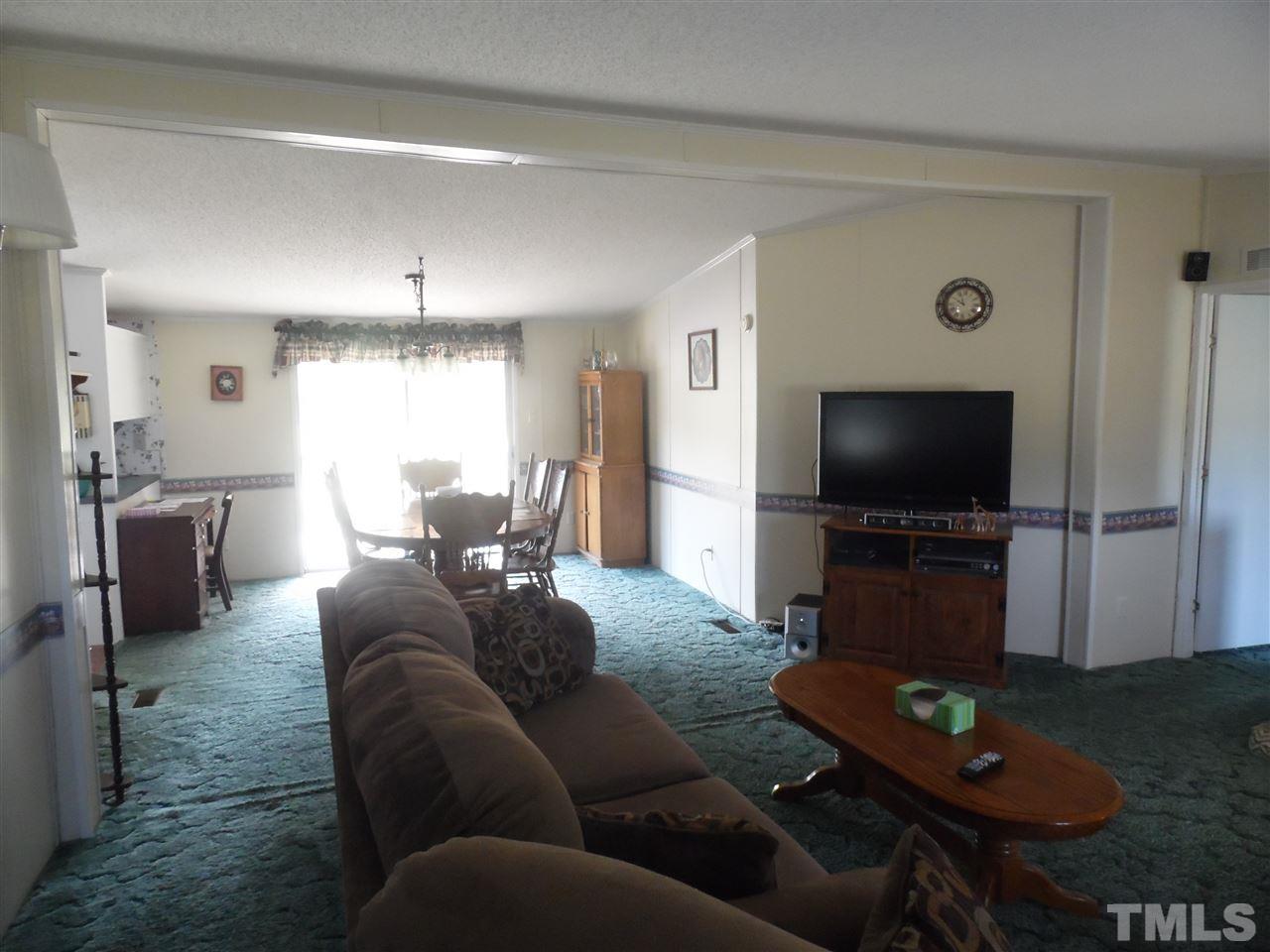 10582 Cone Road Middlesex, NC 27557 - Photo 5 of 25 a living room with furniture and a flat screen tv