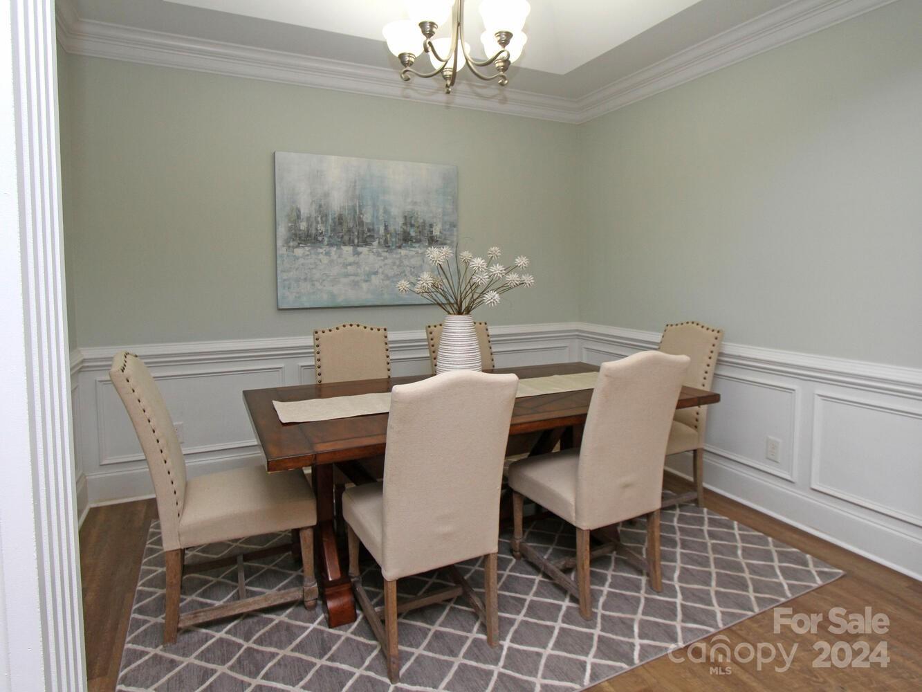 608 Crosswater Lane Fort Mill, SC 29708 - Photo 12 of 42 a view of a dining room with furniture and chandelier