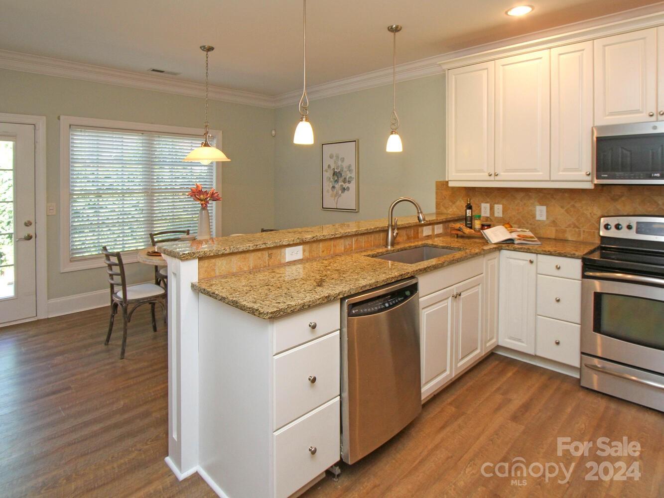 608 Crosswater Lane Fort Mill, SC 29708 - Photo 13 of 42 a kitchen with a sink stove and cabinets