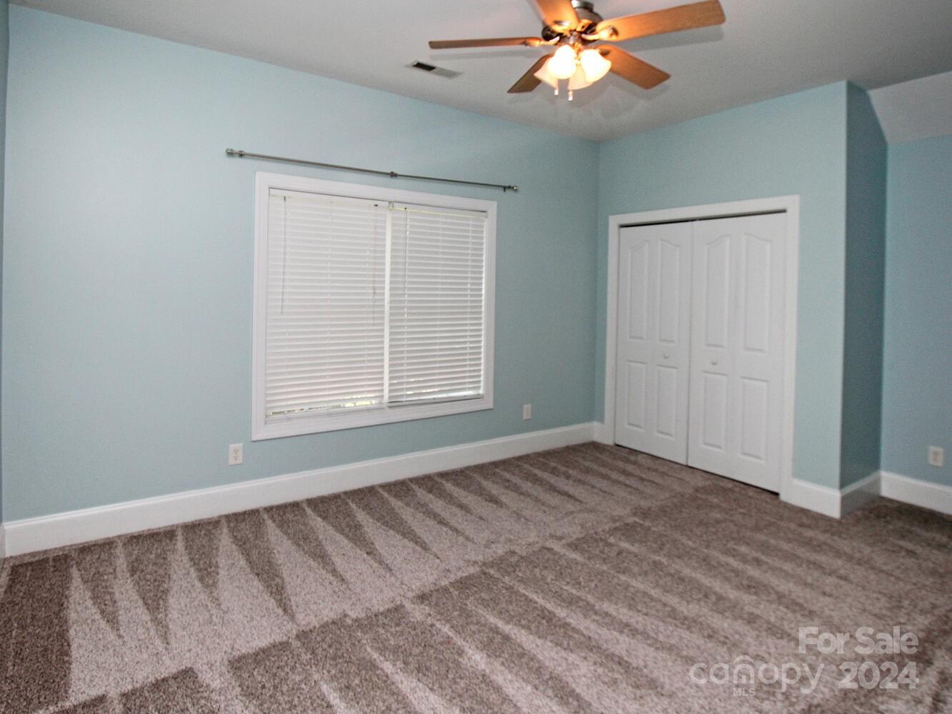 608 Crosswater Lane Fort Mill, SC 29708 - Photo 31 of 42 a view of an empty room with window chandelier fan
