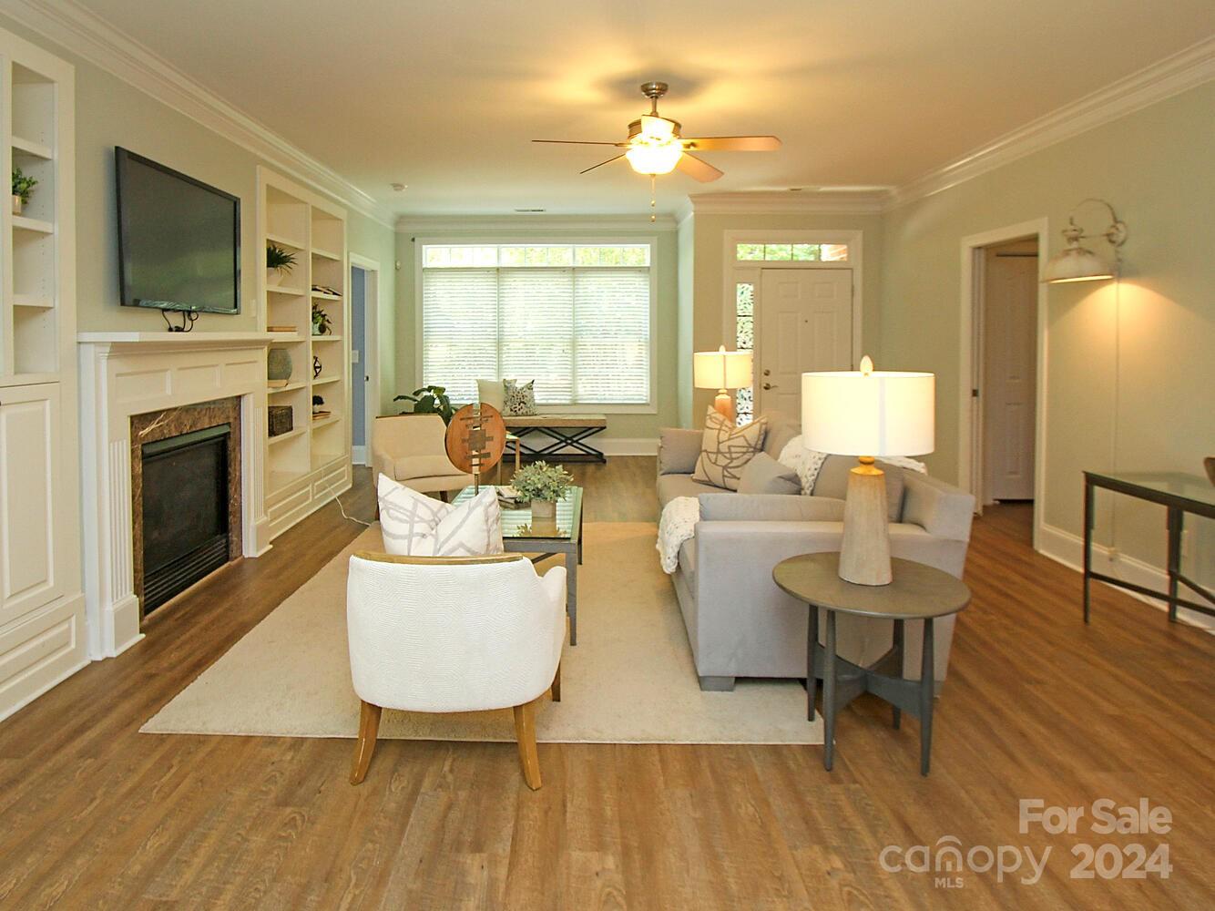 608 Crosswater Lane Fort Mill, SC 29708 - Photo 4 of 42 a living room with fireplace furniture and a flat screen tv