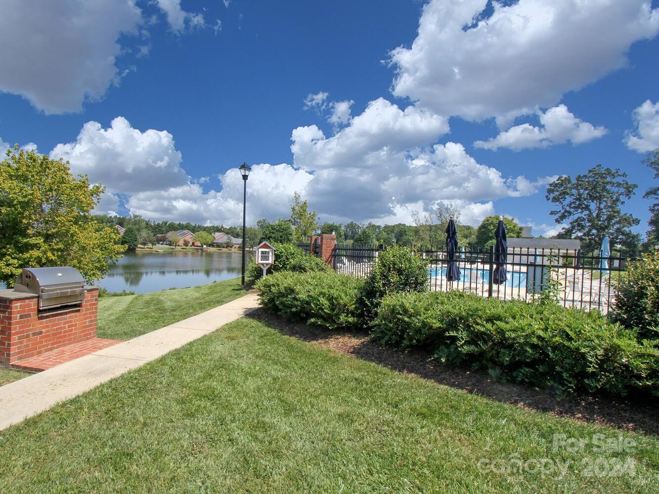 608 Crosswater Lane Fort Mill, SC 29708 - Photo 42 of 42 a view of a lake and a garden