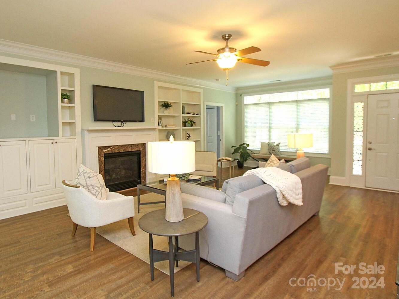608 Crosswater Lane Fort Mill, SC 29708 - Photo 5 of 42 a living room with furniture fireplace and a flat screen tv