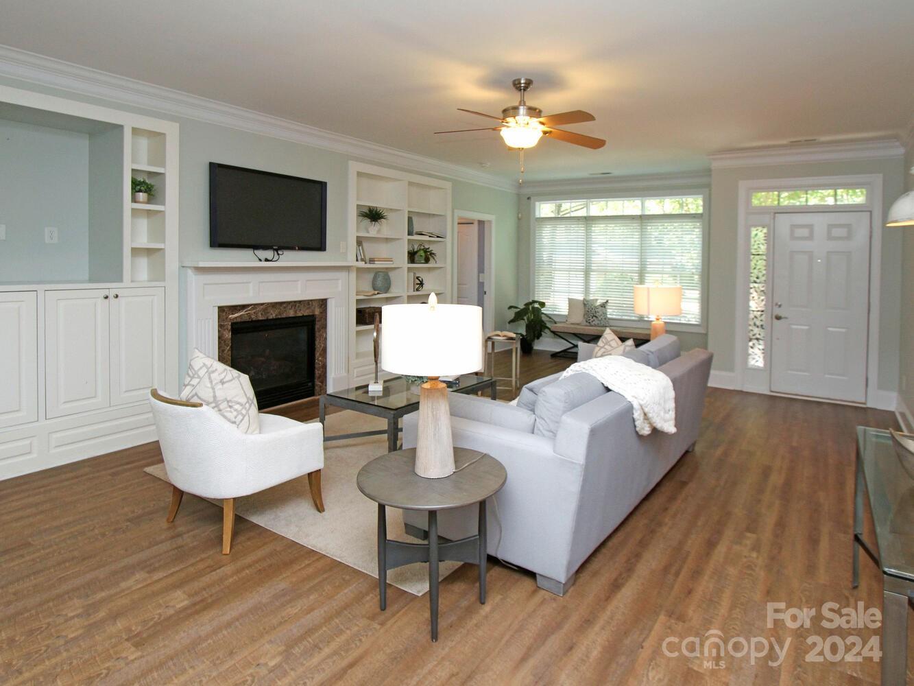 608 Crosswater Lane Fort Mill, SC 29708 - Photo 9 of 42 a living room with furniture and a fireplace