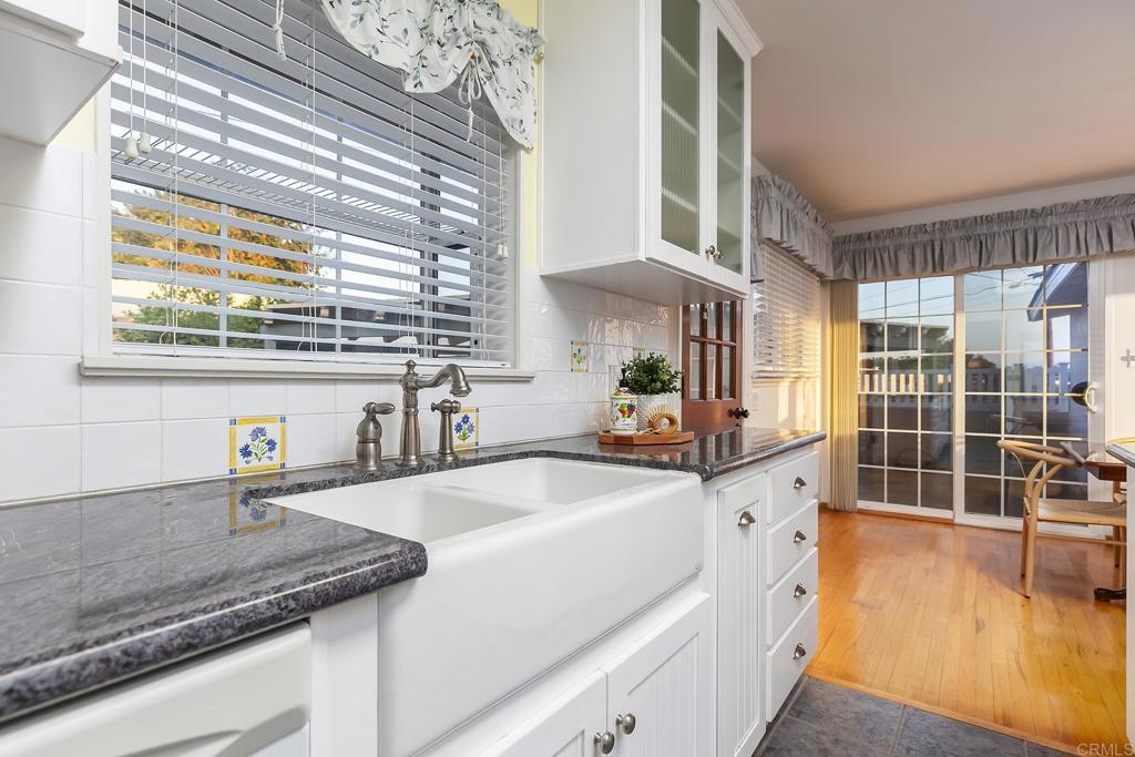 1407 Cascade Place El Cajon, CA 92021 - Photo 12 of 43 a kitchen with stainless steel appliances granite countertop a sink a stove and a wooden cabinets
