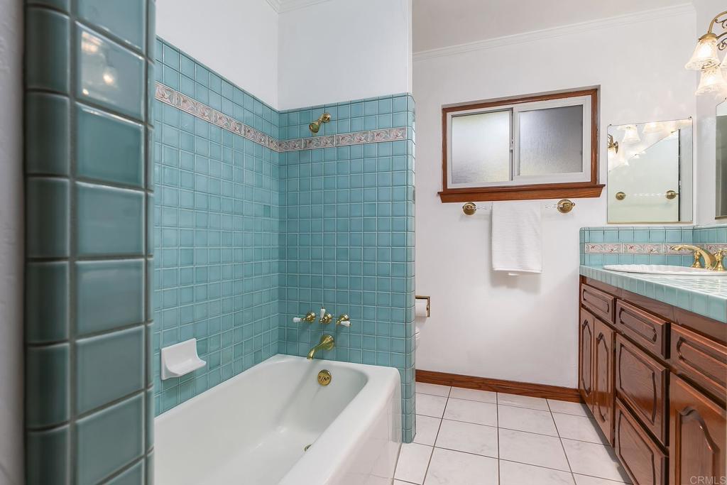 1407 Cascade Place El Cajon, CA 92021 - Photo 16 of 43 a bathroom with a sink a toilet and mirror