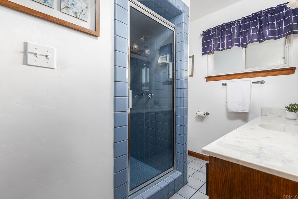 1407 Cascade Place El Cajon, CA 92021 - Photo 20 of 43 a bathroom with a shower and a sink