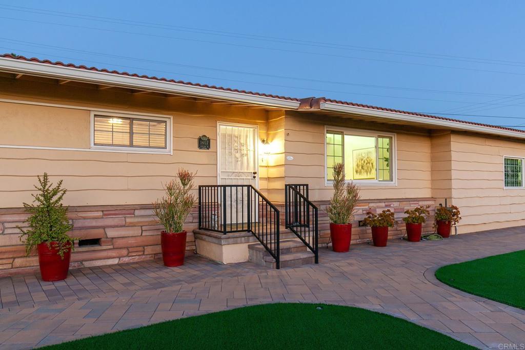 1407 Cascade Place El Cajon, CA 92021 - Photo 23 of 43 a backyard of a house with barbeque oven table and chairs