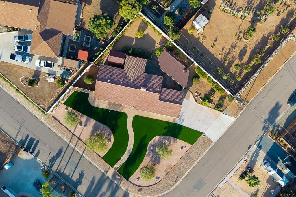 1407 Cascade Place El Cajon, CA 92021 - Photo 24 of 43 an aerial view of a house with a yard and outdoor seating