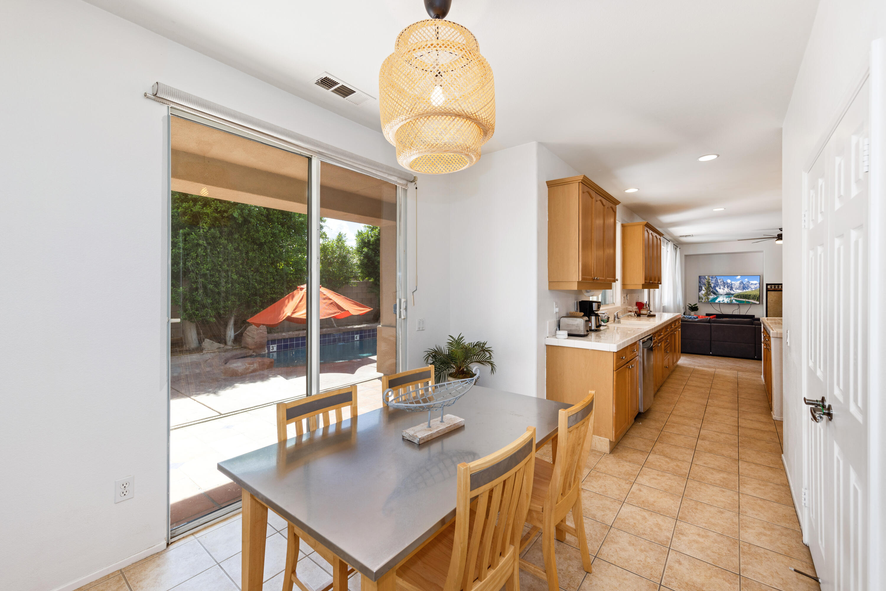 83299 Stagecoach Road Indio, CA 92203 - Photo 15 of 44 a dining room with furniture and a window