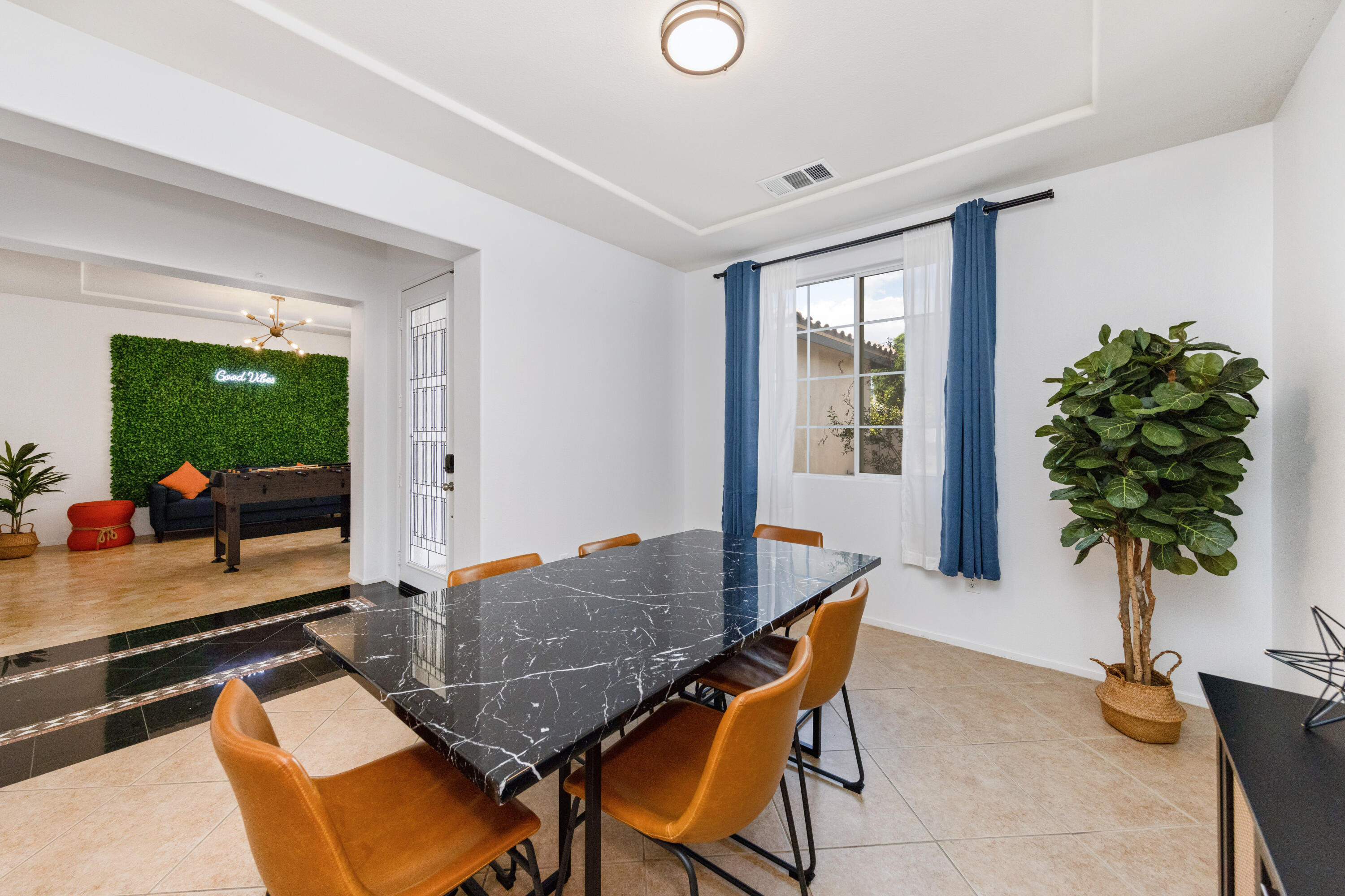 83299 Stagecoach Road Indio, CA 92203 - Photo 16 of 44 a living room with furniture and a potted plant