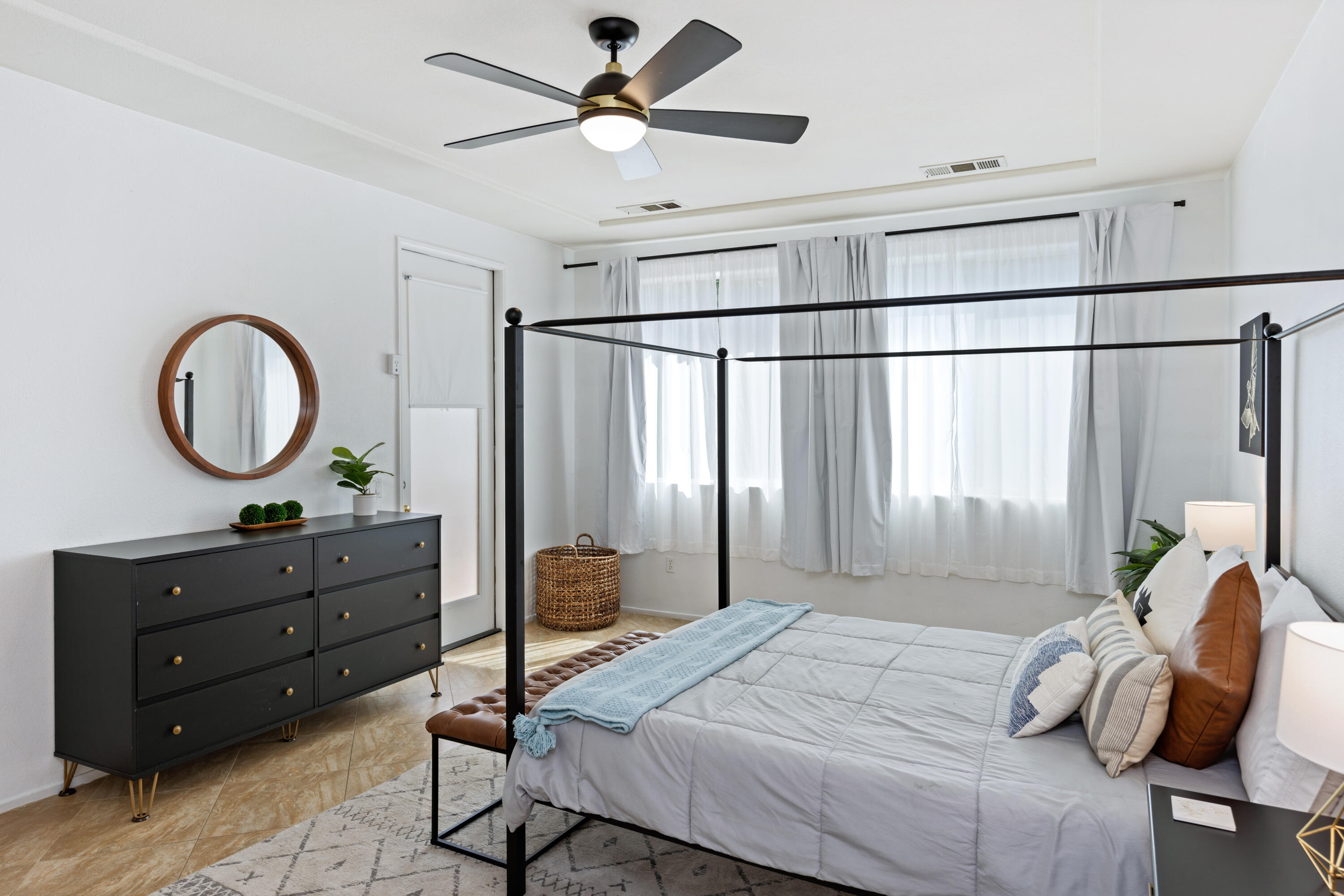 83299 Stagecoach Road Indio, CA 92203 - Photo 18 of 44 a bedroom with a bed and a chandelier