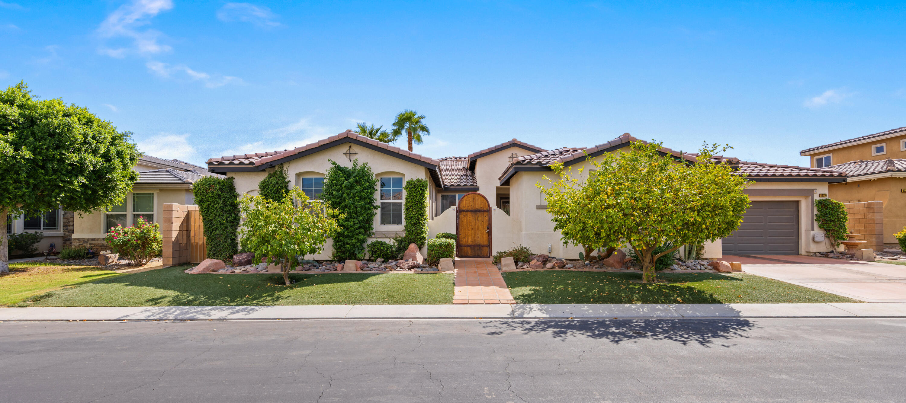 83299 Stagecoach Road Indio, CA 92203 - Photo 2 of 44 front view of a house with a yard
