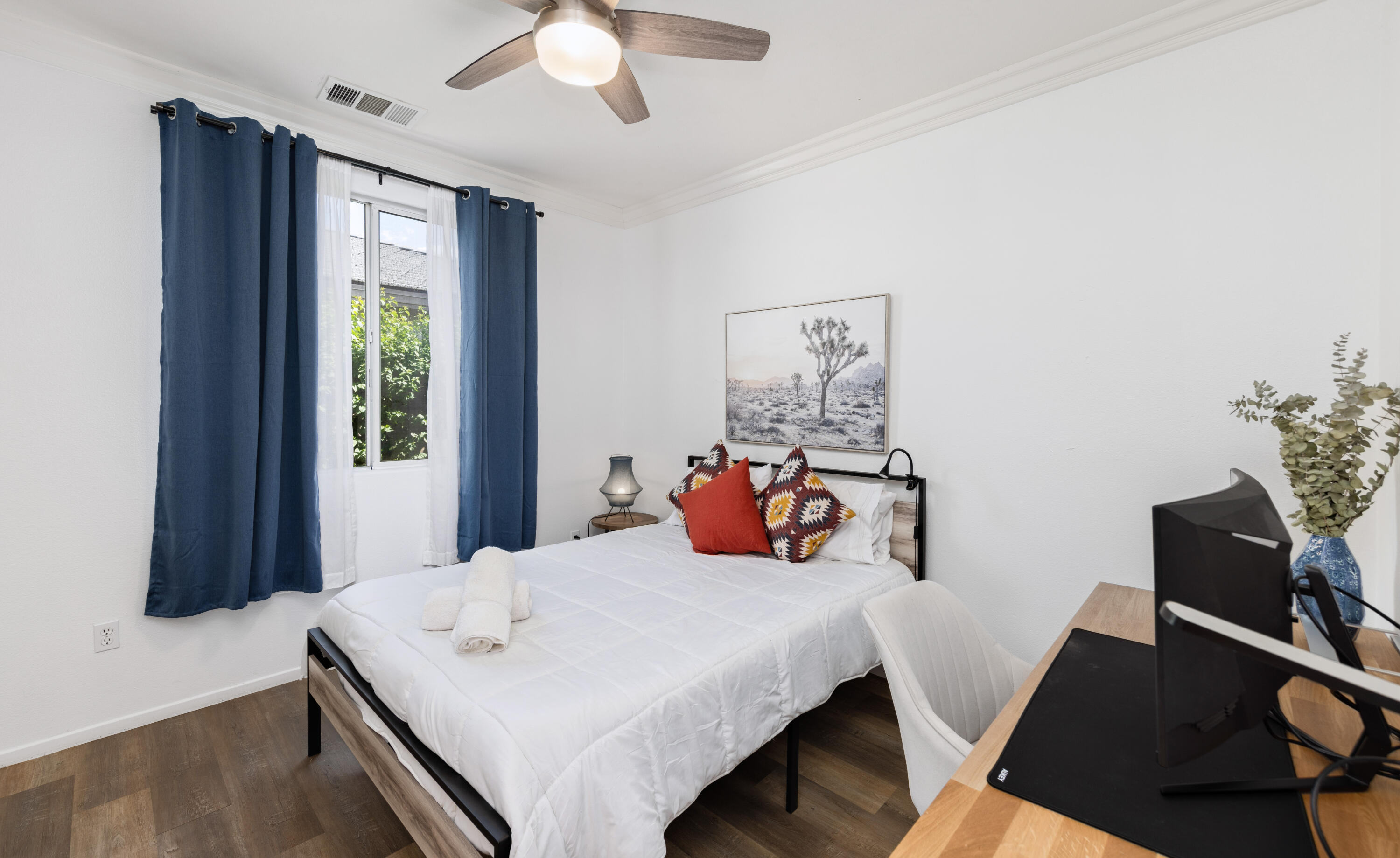 83299 Stagecoach Road Indio, CA 92203 - Photo 22 of 44 a bedroom with a bed and a chandelier