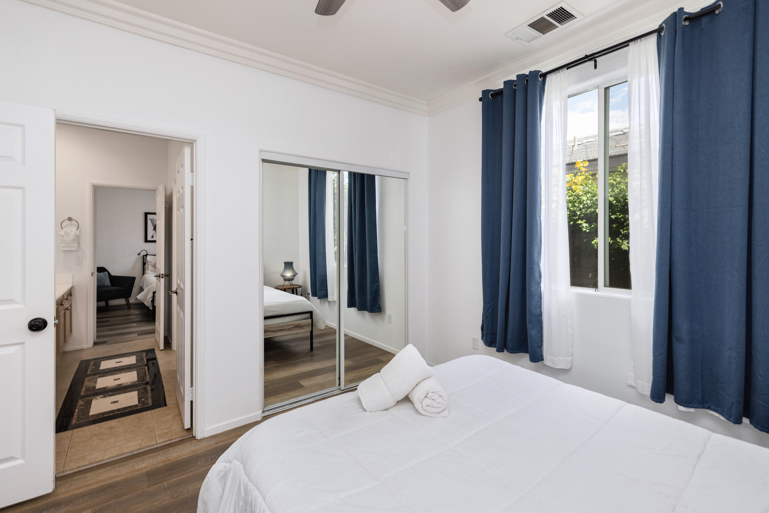 83299 Stagecoach Road Indio, CA 92203 - Photo 23 of 44 a bedroom with a bed and wooden floor