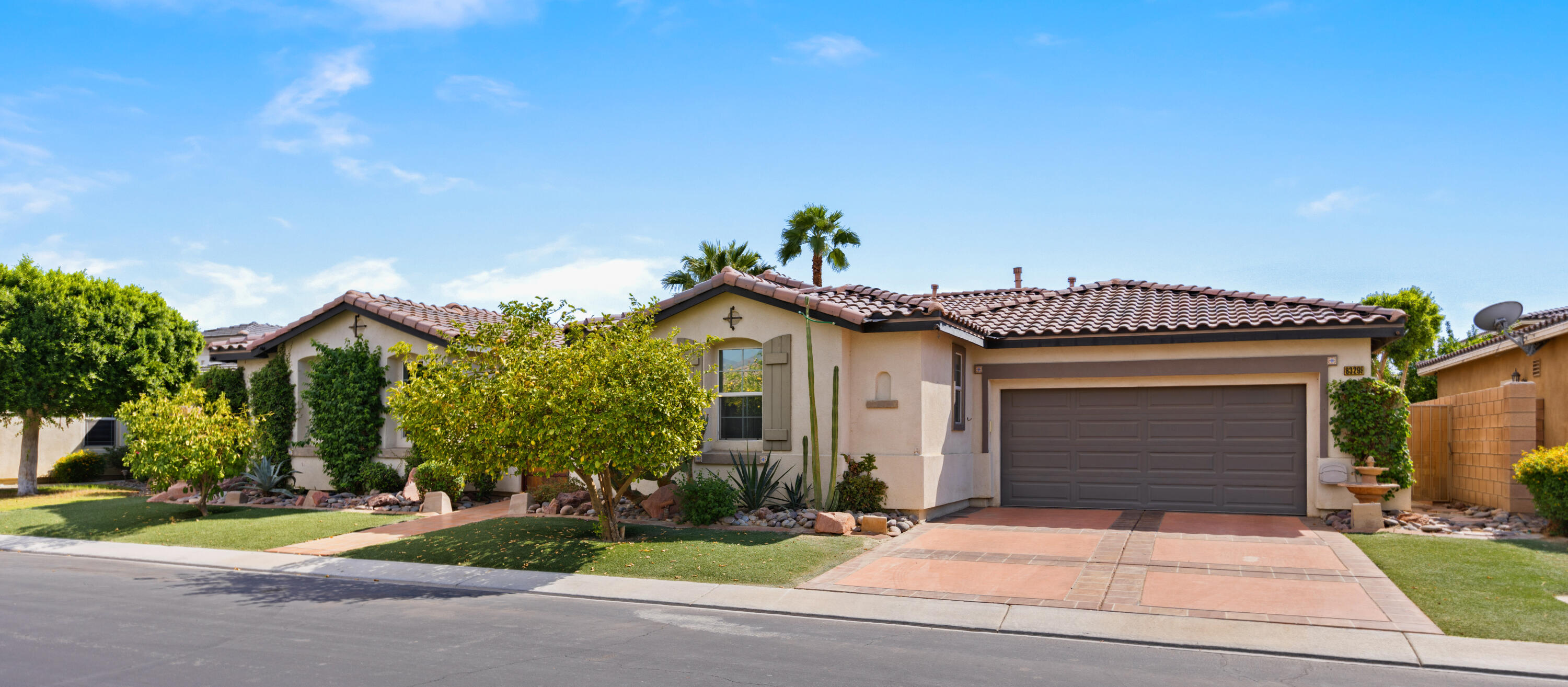 83299 Stagecoach Road Indio, CA 92203 - Photo 3 of 44 a front view of a house with garden