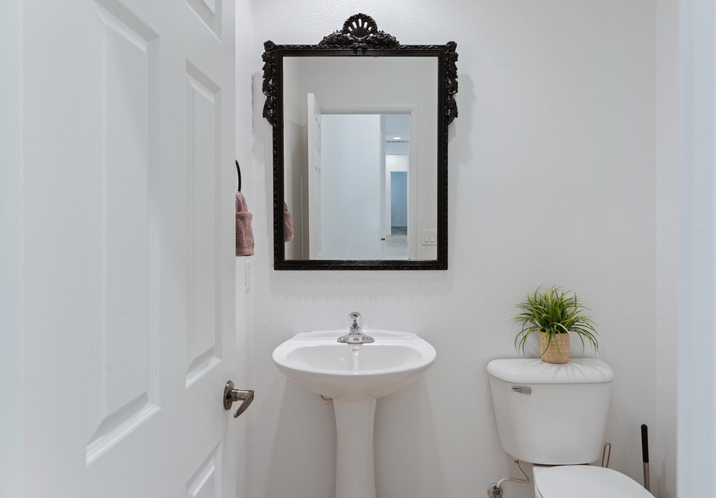 83299 Stagecoach Road Indio, CA 92203 - Photo 31 of 44 a bathroom with a toilet sink and mirror
