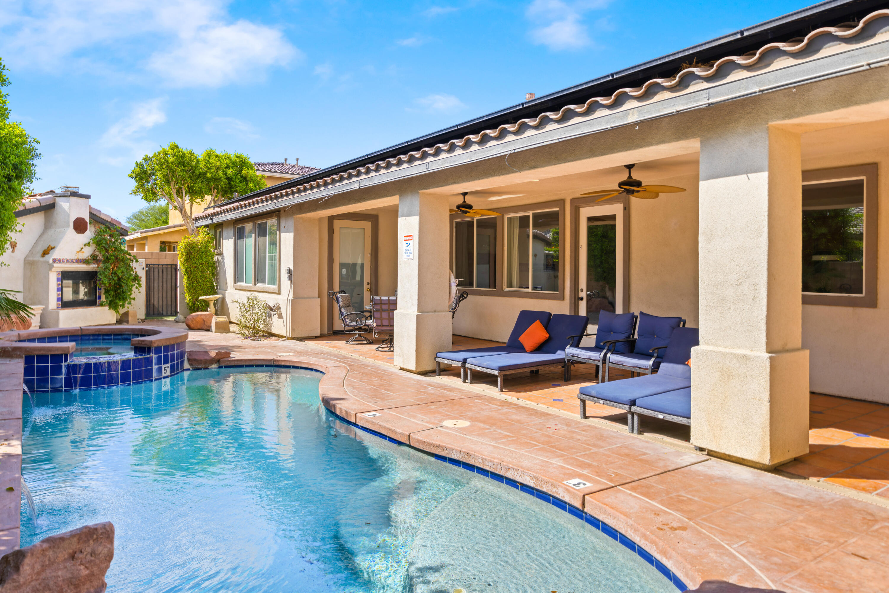 83299 Stagecoach Road Indio, CA 92203 - Photo 36 of 44 a view of a house with swimming pool and sitting area