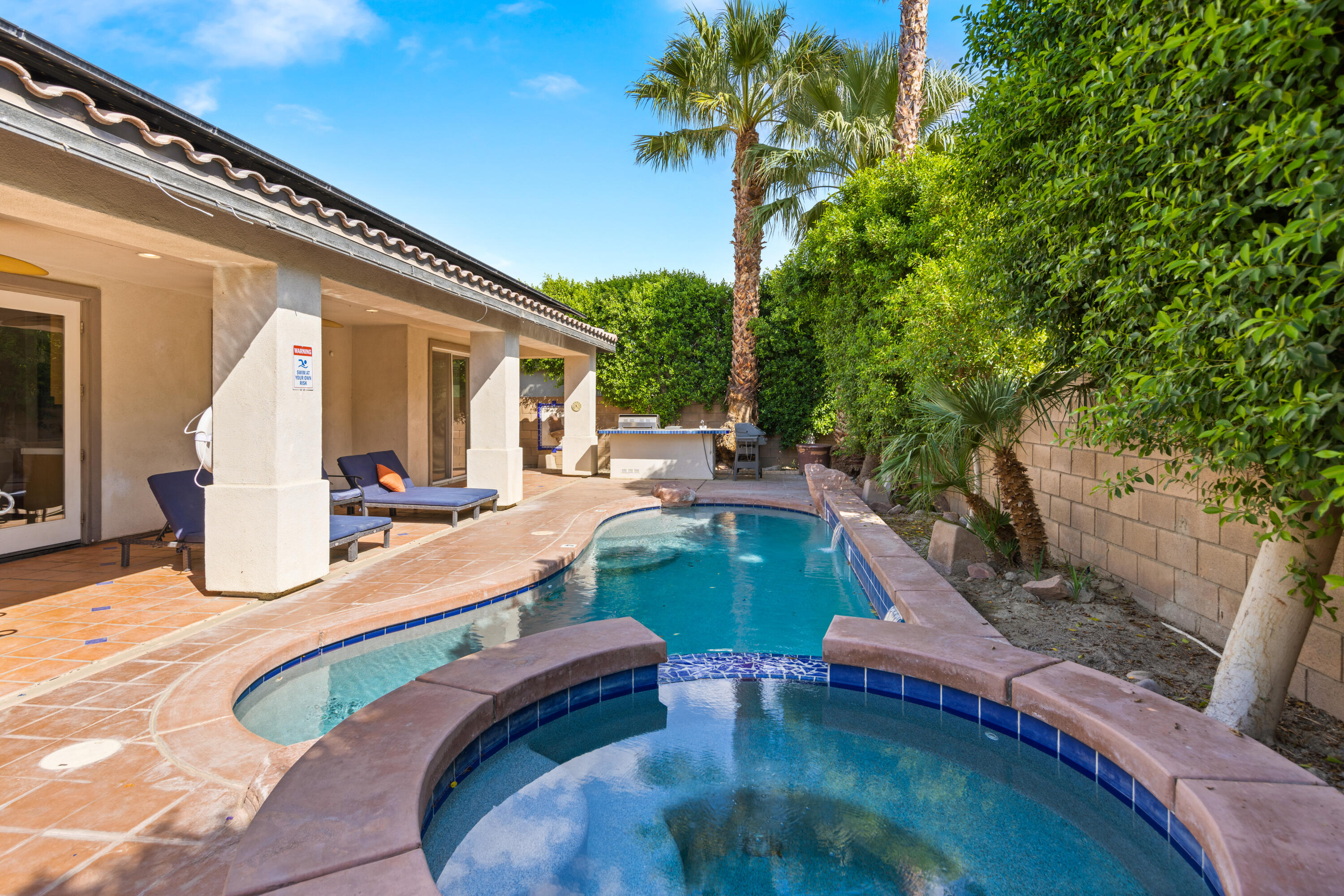 83299 Stagecoach Road Indio, CA 92203 - Photo 37 of 44 a view of a swimming pool with a patio