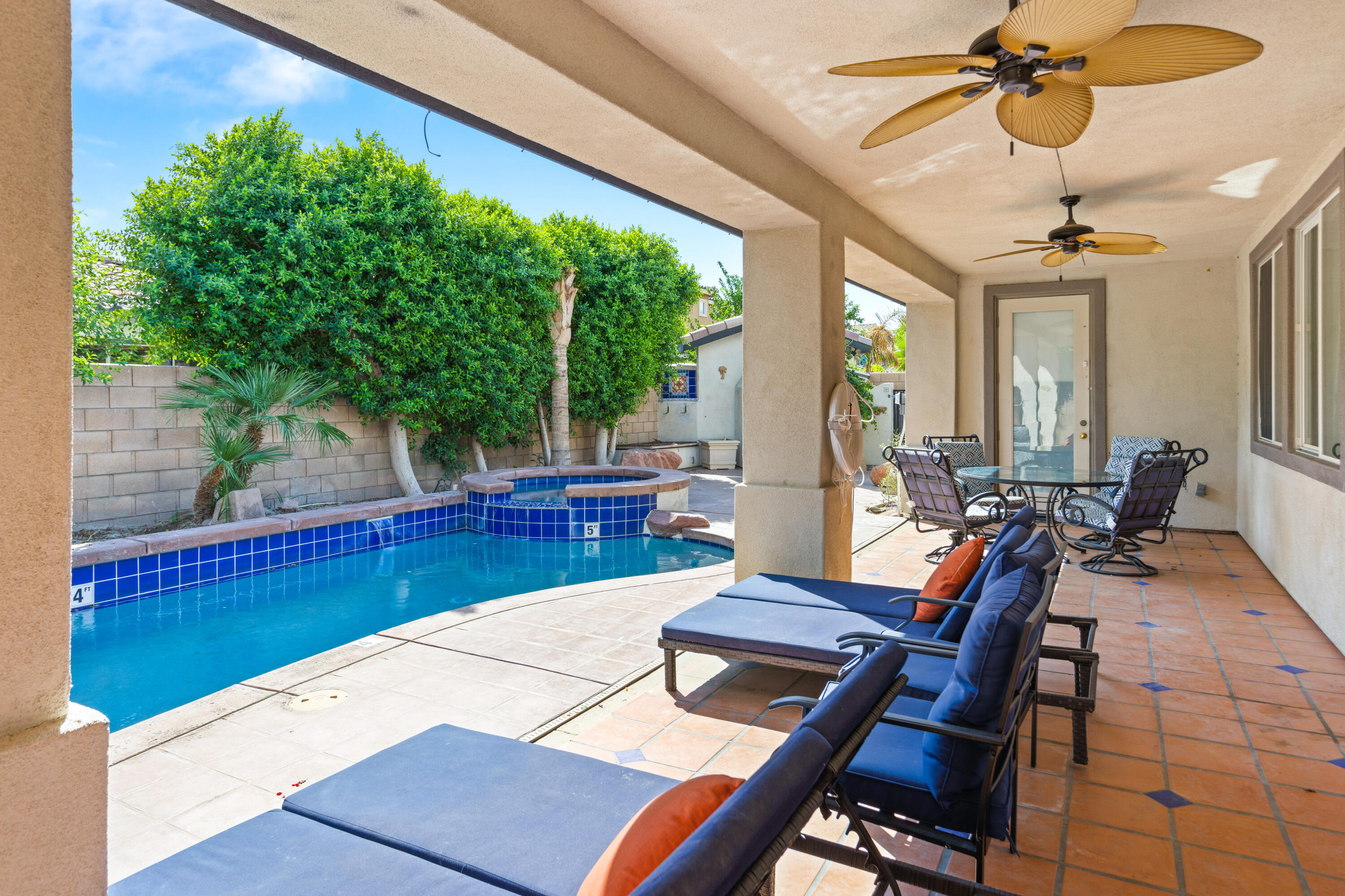 83299 Stagecoach Road Indio, CA 92203 - Photo 38 of 44 a view of a dining room with furniture window and wooden floor