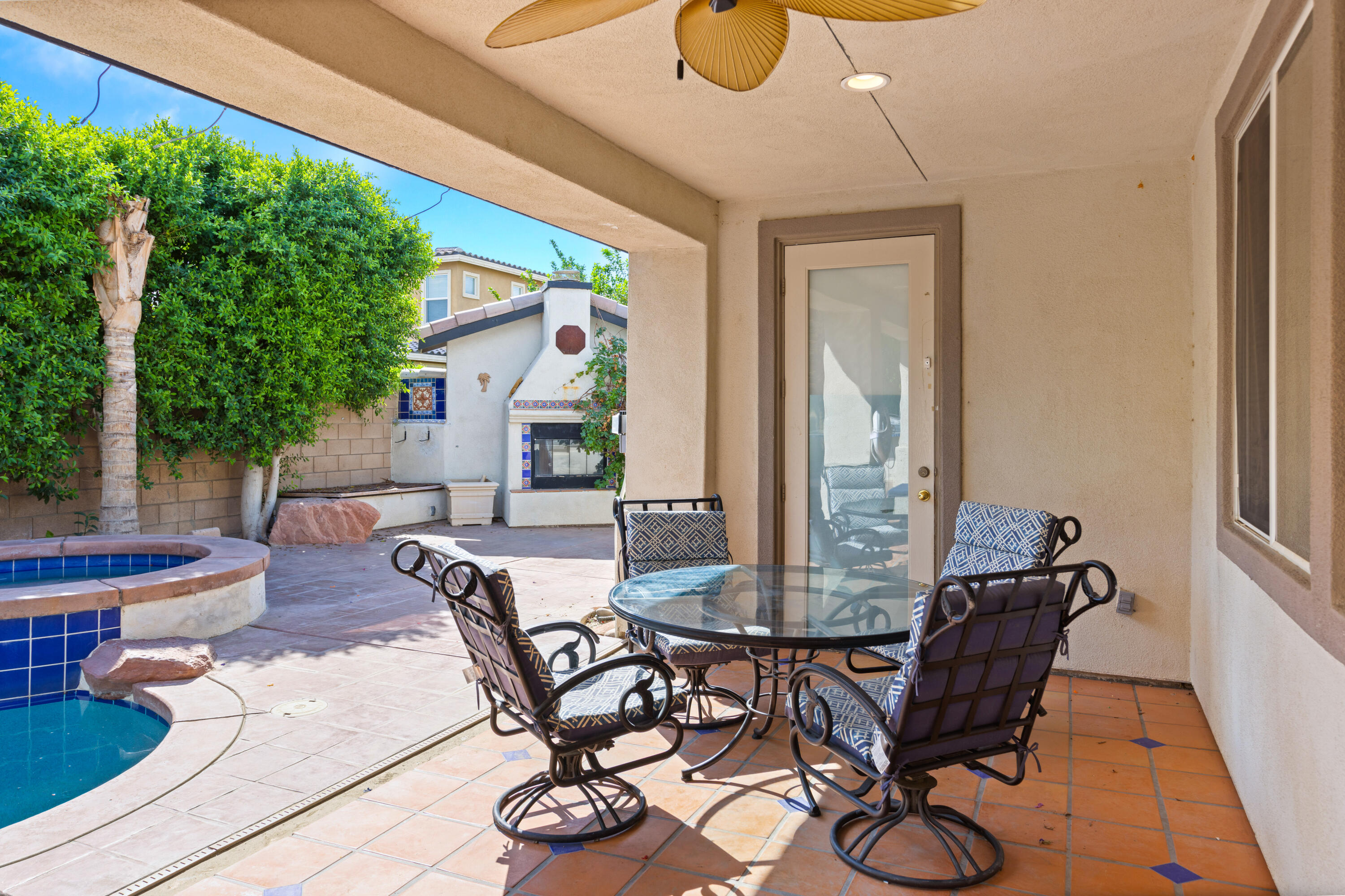 83299 Stagecoach Road Indio, CA 92203 - Photo 39 of 44 a view of a patio with table and chairs and potted plants