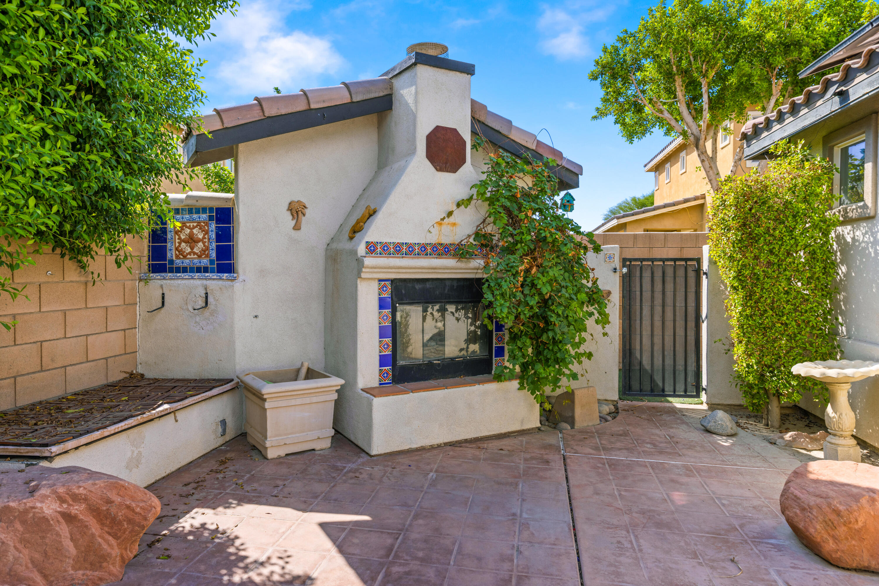 83299 Stagecoach Road Indio, CA 92203 - Photo 40 of 44 a view of a chair and table in backyard of the house