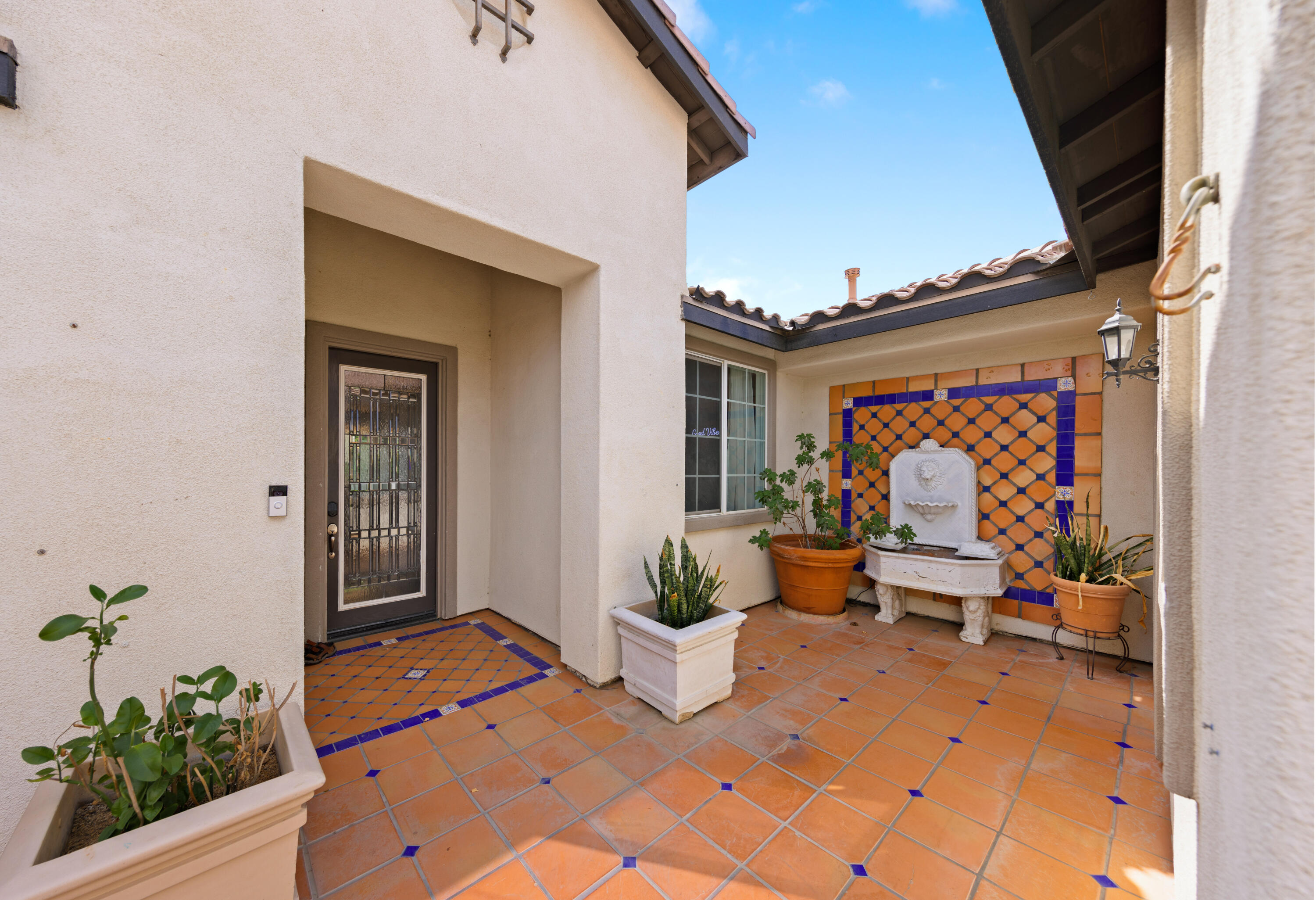 83299 Stagecoach Road Indio, CA 92203 - Photo 4 of 44 a balcony with furniture and potted plants