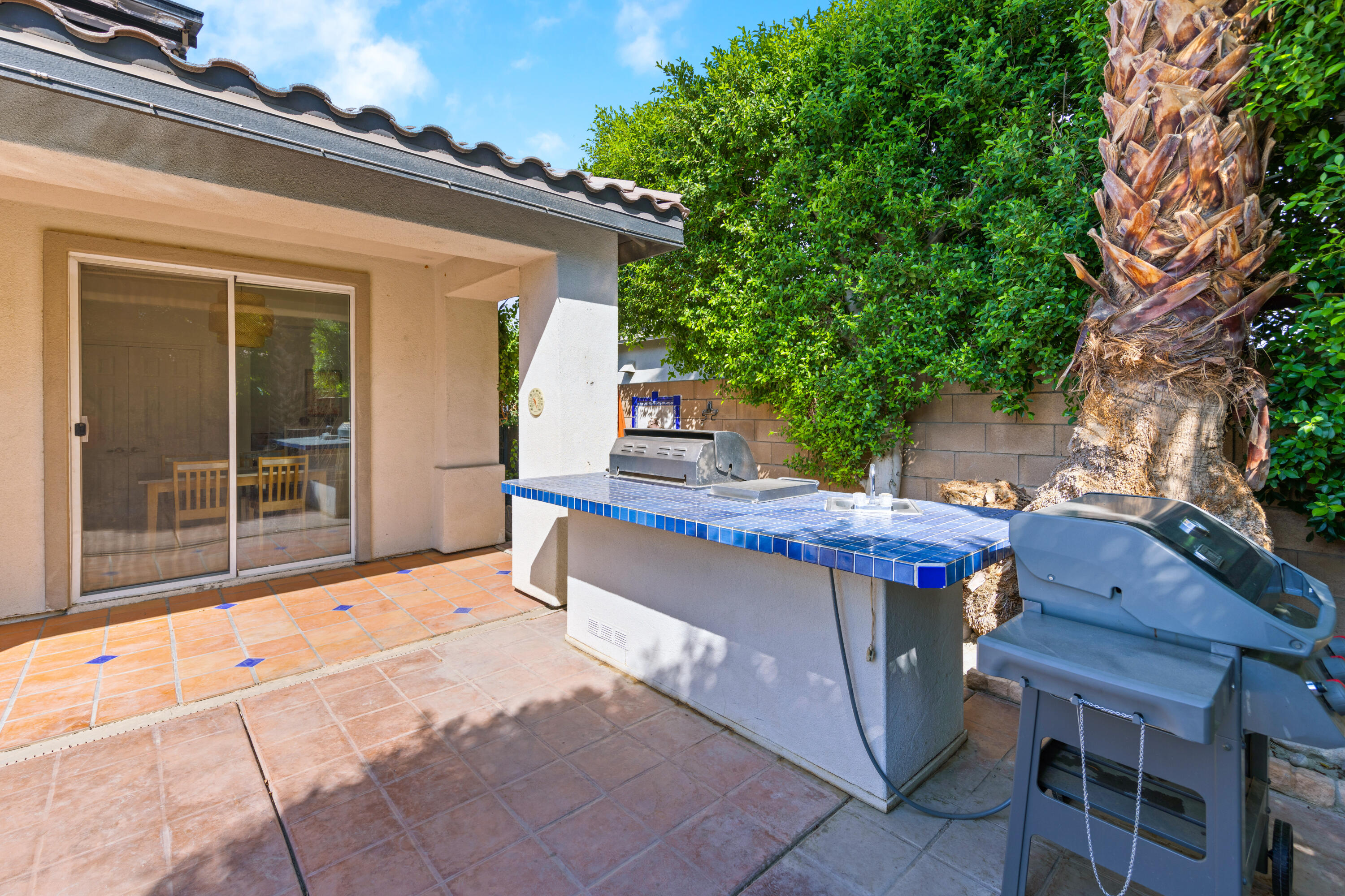 83299 Stagecoach Road Indio, CA 92203 - Photo 41 of 44 a view of a chairs and table in the back yard of the house
