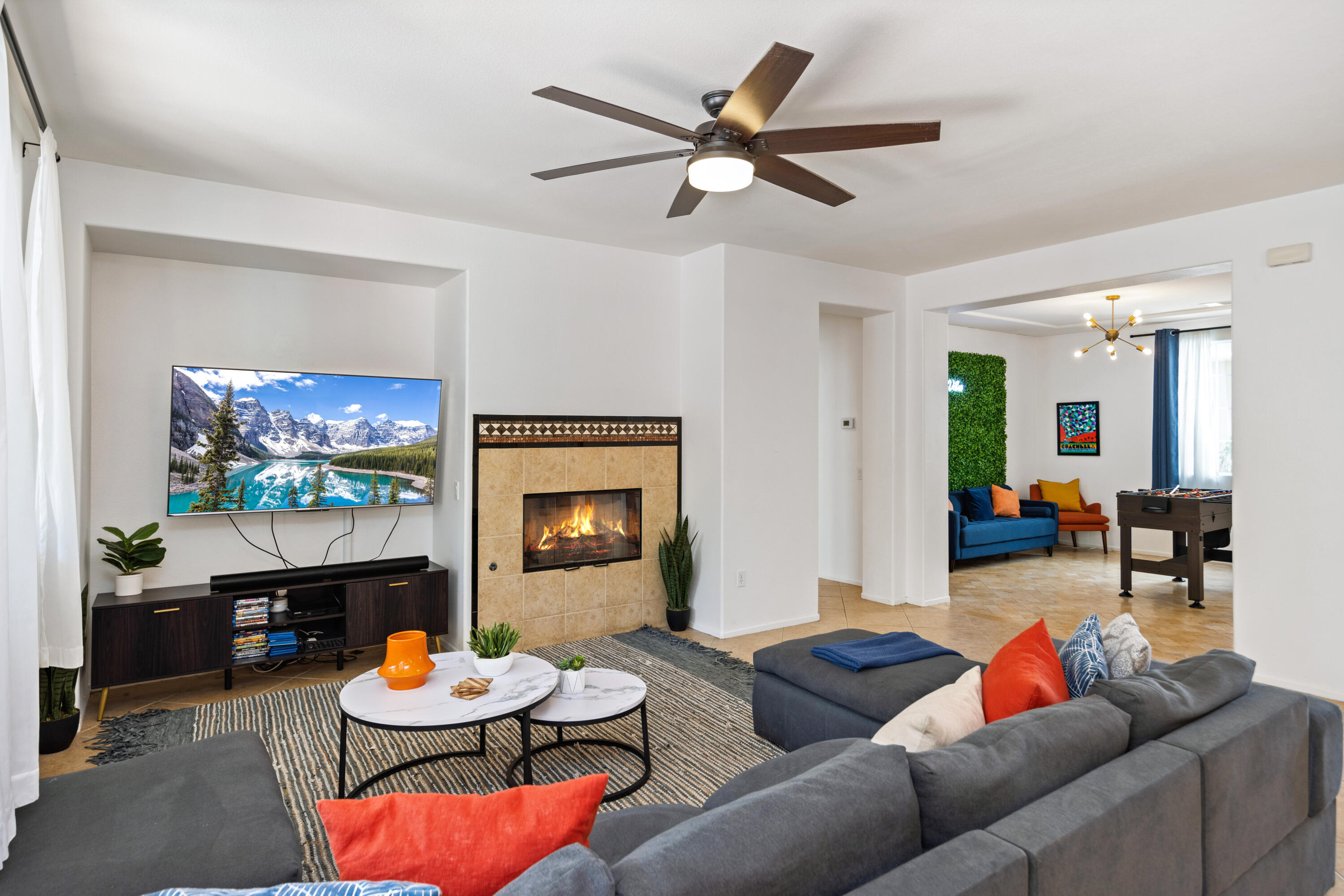 83299 Stagecoach Road Indio, CA 92203 - Photo 8 of 44 a living room with furniture a fireplace and a flat screen tv