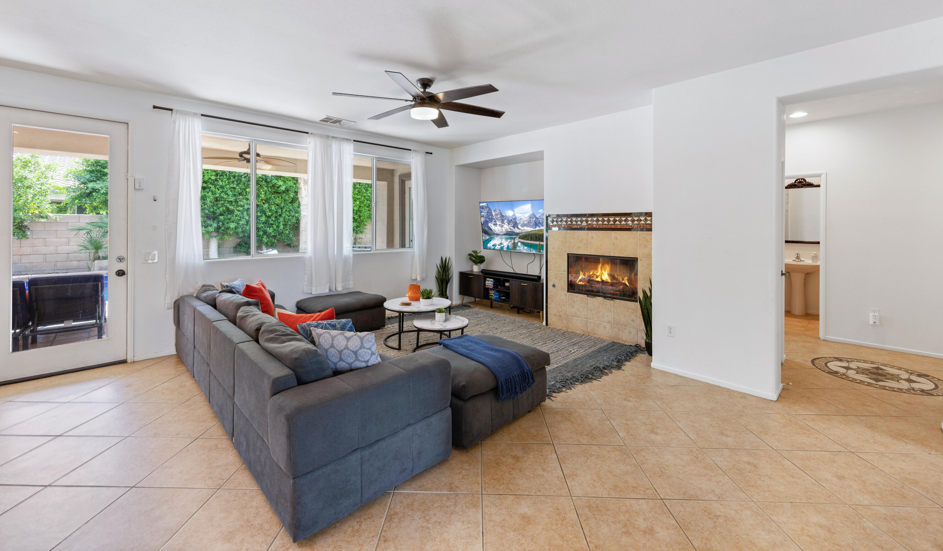 83299 Stagecoach Road Indio, CA 92203 - Photo 9 of 44 a living room with furniture and a fireplace