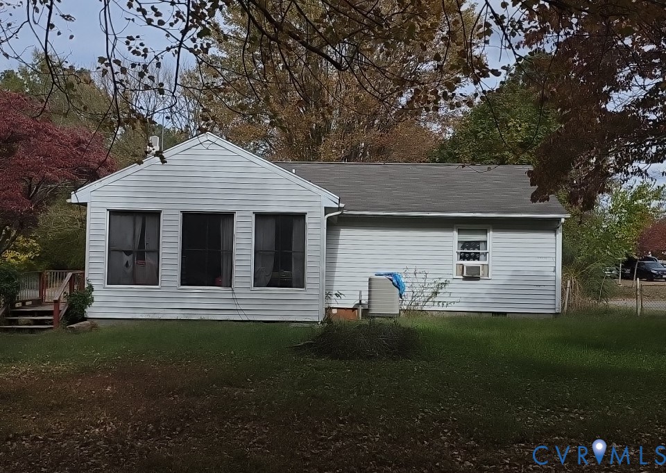 12246 Bunya Lane Ruther Glen, VA 22546 - Photo 2 of 3 a front view of a house with a yard and yard