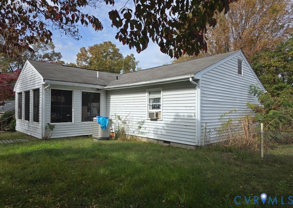 12246 Bunya Lane Ruther Glen, VA 22546 - Photo 3 of 3 a front view of a house with a yard and garage