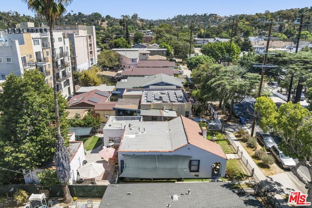 an aerial view of a house with a yard