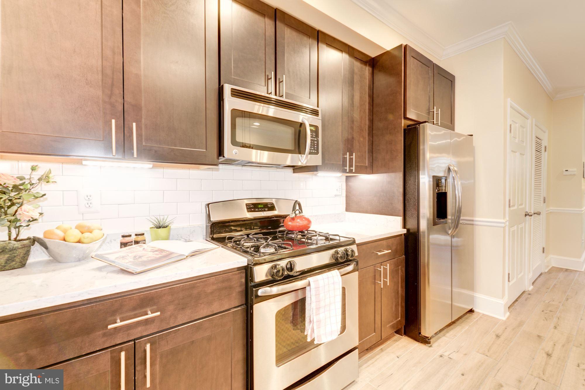 1630 Rosedale Street Northeast, Unit 1 Washington, DC 20002 - Photo 10 of 30 Subway tile backsplash & quartz countertops