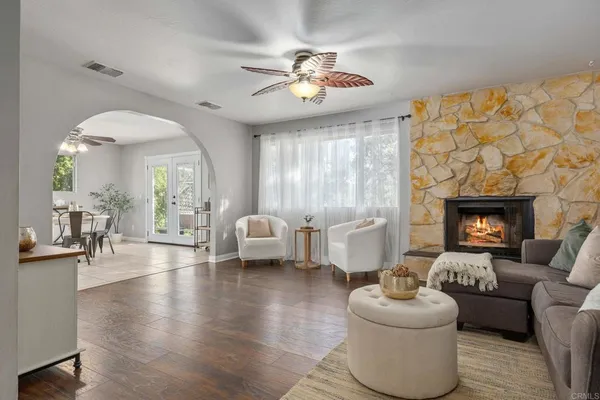 a living room with furniture and a fireplace
