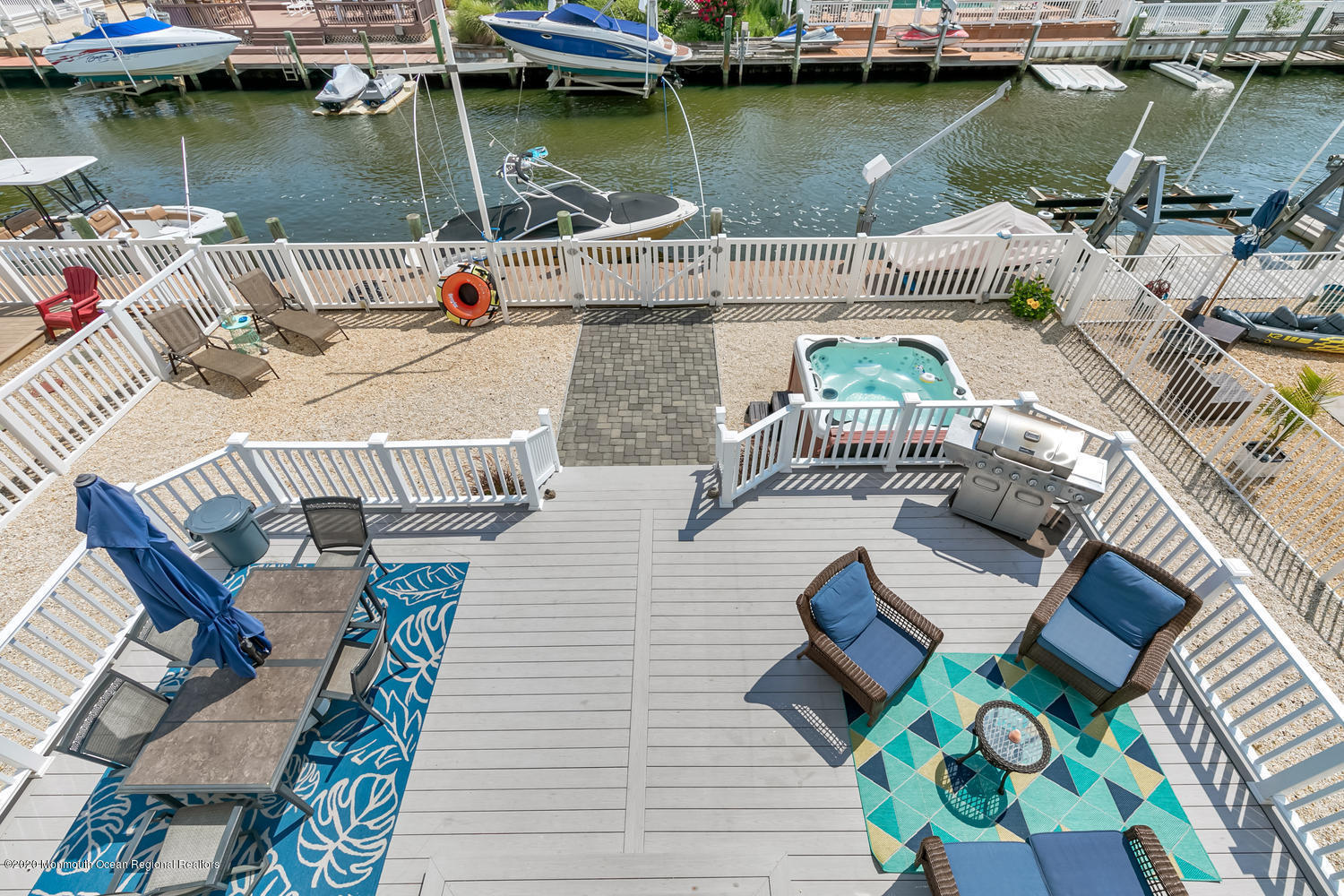 23 Pilot Road Toms River, NJ 08753 - Photo 54 of 62 a view of a lake with couches chairs and wooden floor