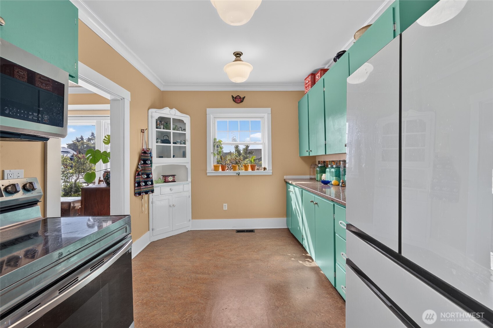 237 West 3rd Street Port Angeles, WA 98362 - Photo 12 of 40 a kitchen with window and stainless steel appliances
