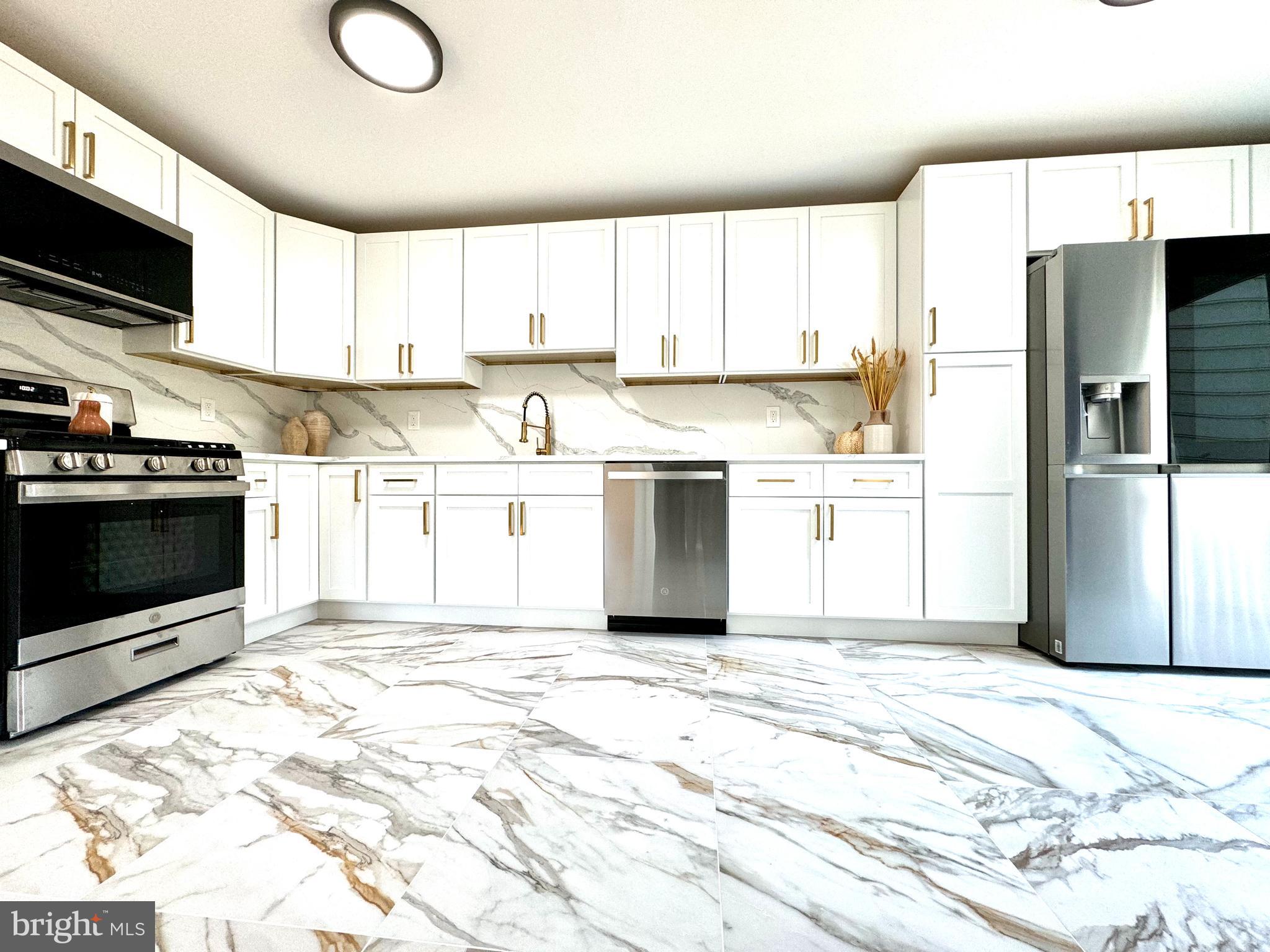 3 Mint Leaf Drive Hamilton, NJ 08690 - Photo 11 of 33 a kitchen with stainless steel appliances granite countertop a refrigerator a stove top oven a sink and dishwasher